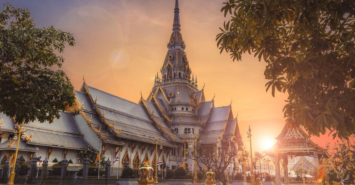 Vibrant Thai street market scene where vendors and shoppers experience everyday time in thai language