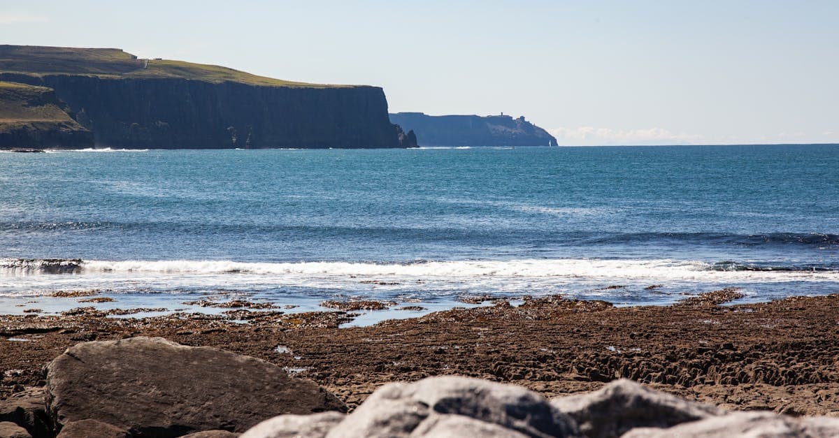 Sunny view of the Cliffs of Moher in the cheapest month to visit Ireland on a budget