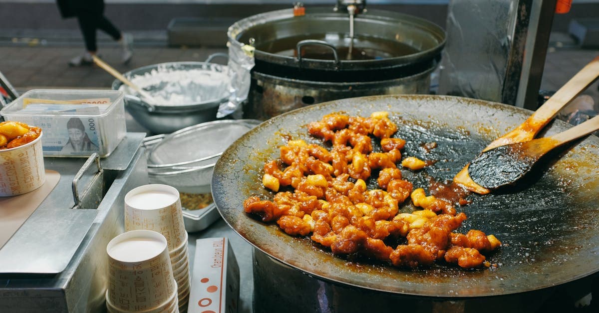 Sizzling Korean street food classics including grilled skewers, rice cakes, and bubbling broth-based dishes.