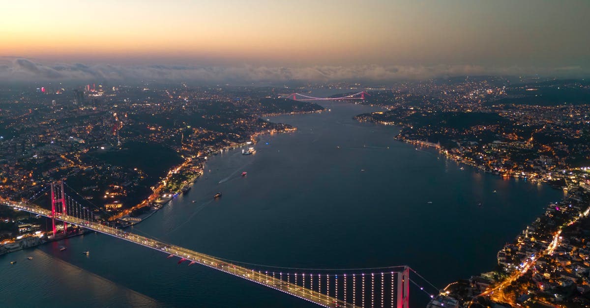 Illuminated Istanbul Bosphorus Bridge at twilight, a landmark city travellers explore with an esim turkey plan.