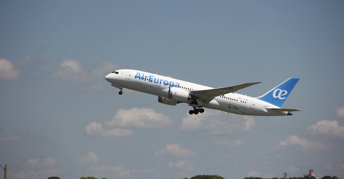 Air Europa airplane in flight during takeoff against a clear sky in Asunción, Paraguay.