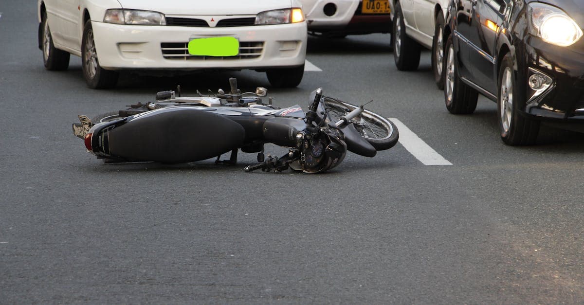 Fallen motorcycle on a city road highlighting scooter accident risks when hiring bikes in Bali