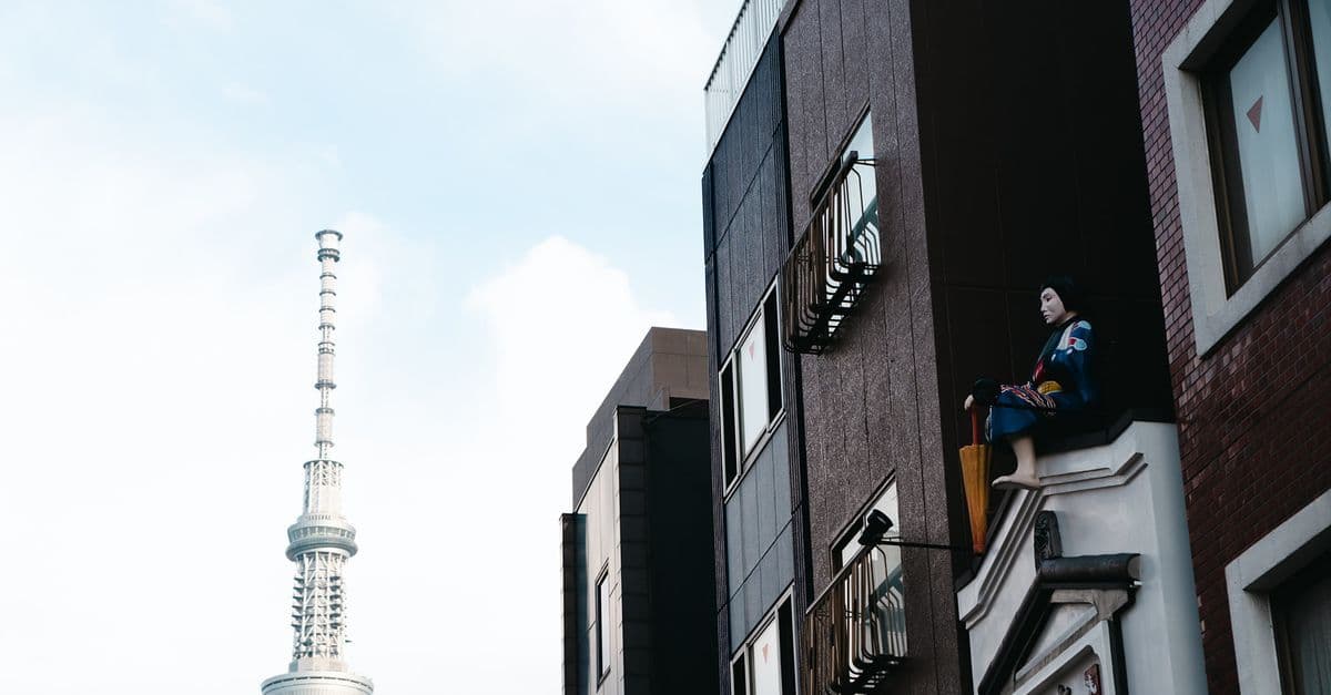 Tokyo Skytree standing tall alongside traditional low-rise architecture in central Tokyo.