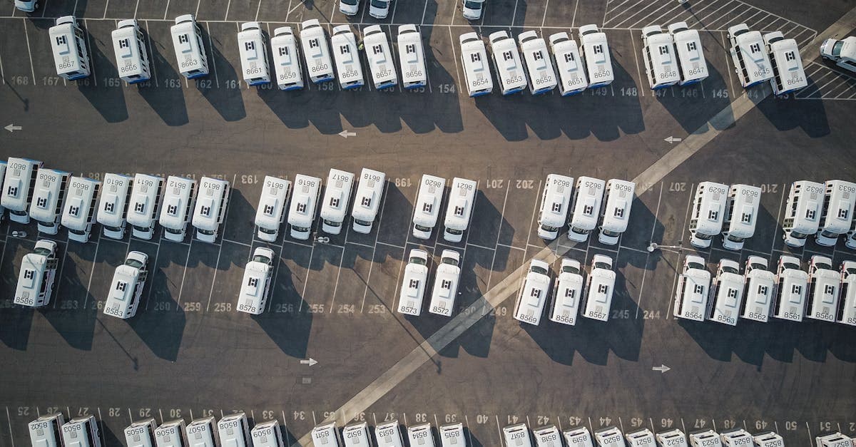 Aerial perspective showcasing a parking lot filled with parked camper vans.