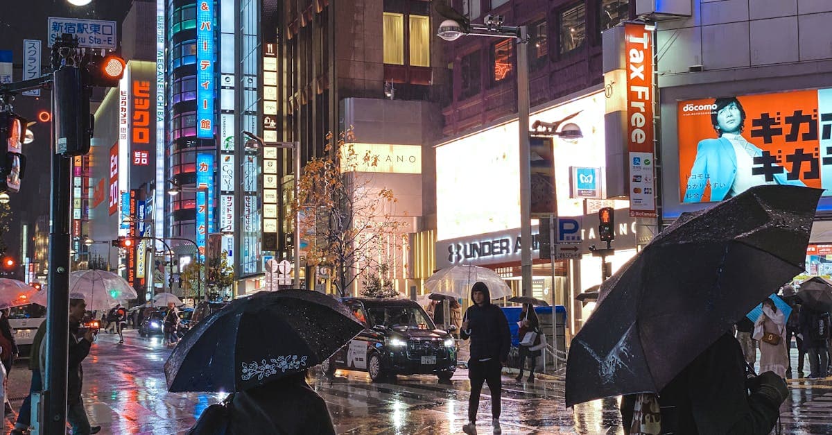 Tokyo neon-lit street reflecting on wet pavement during monsoon, capturing summer nights in Japan