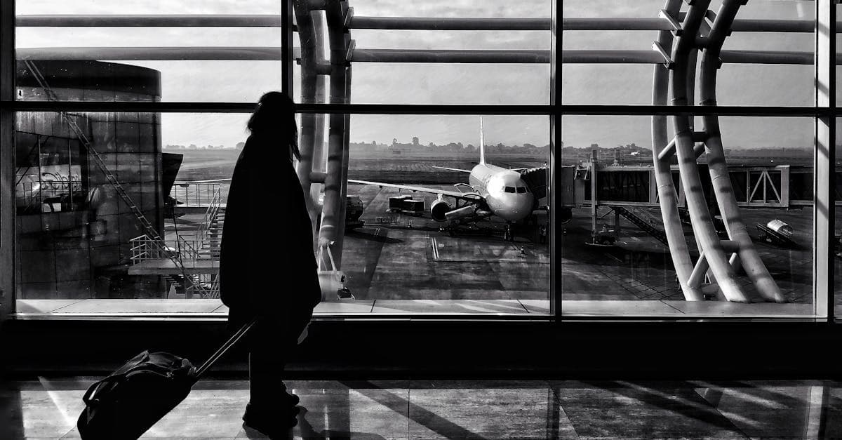 Traveller walking through Naya Raipur airport terminal, highlighting the need for travel insurance in India.