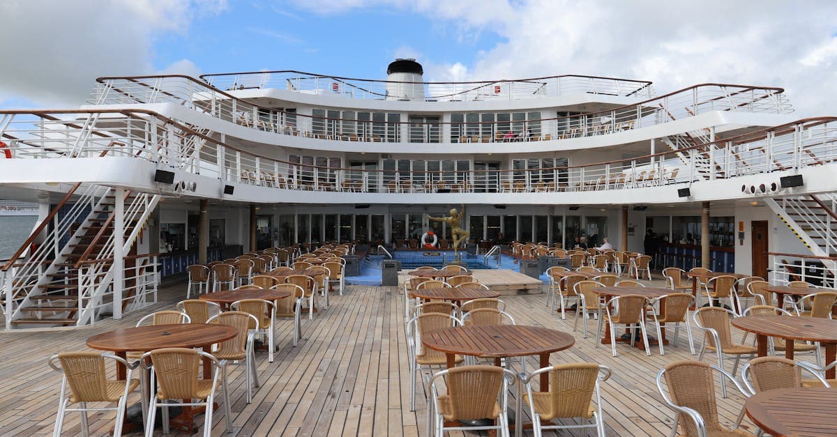 Carnival Adventure deck plans feature open-air leisure spaces with tables and chairs for relaxed onboard dining