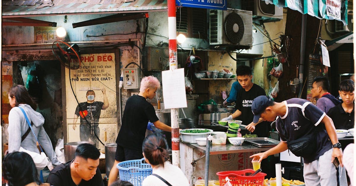 Busy street food stall in Hanoi showcasing authentic vietnamese street foods and local culture