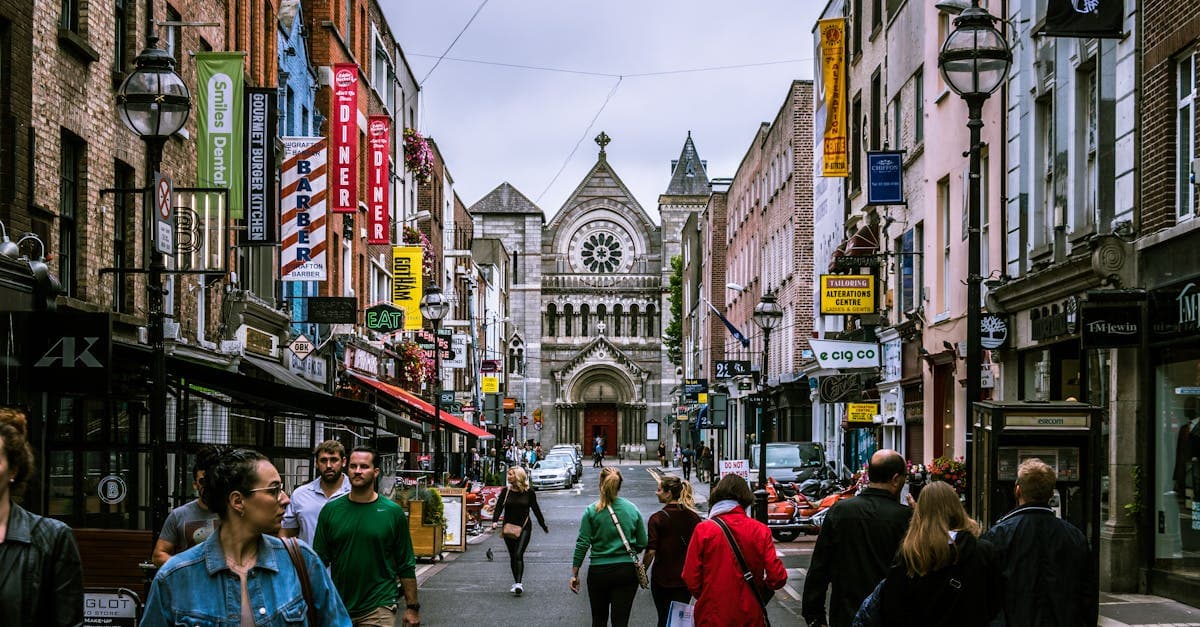 Busy Dublin street with pedestrians and historic buildings, ideal for activating an eSIM on iPhone or Android.