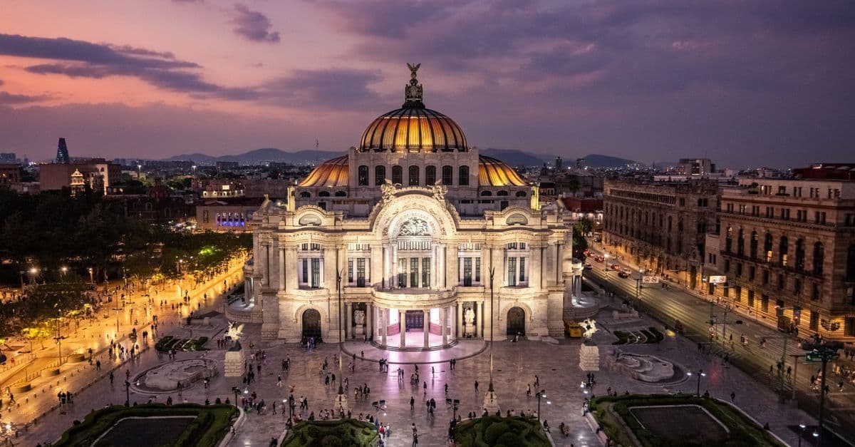 Golden sunset over Palacio de Bellas Artes illustrates the best mexico city weather season for Canadians