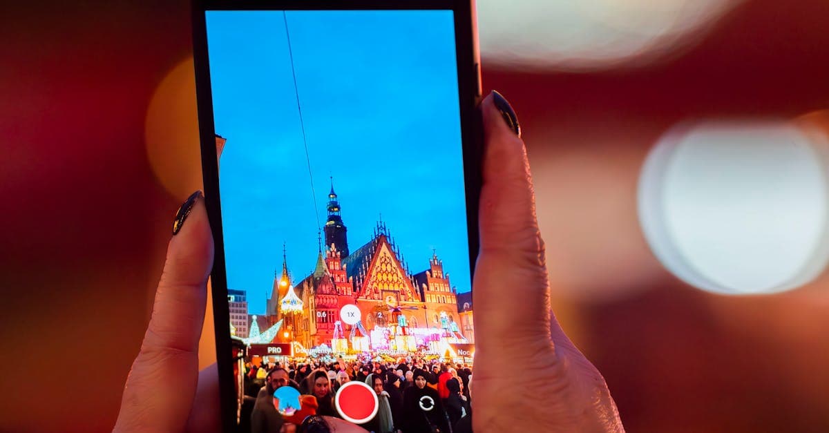 Vibrant scene of Wrocław's festive market captured through a smartphone during twilight.