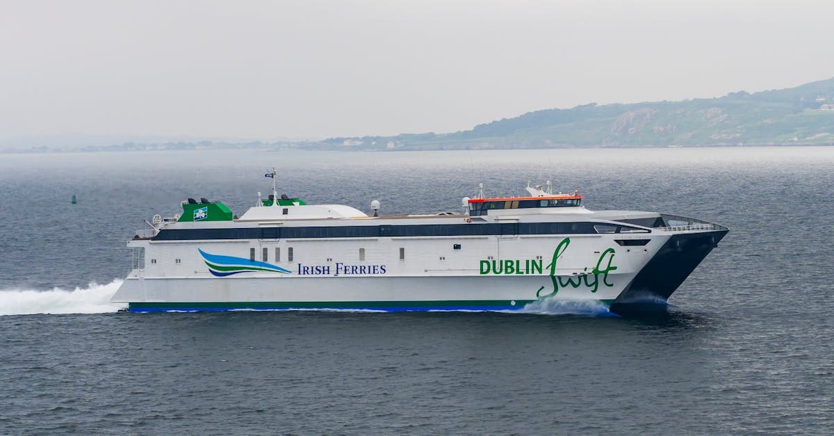 High-speed ferry crossing Irish waters near Dublin, comparing transport options to airport routes