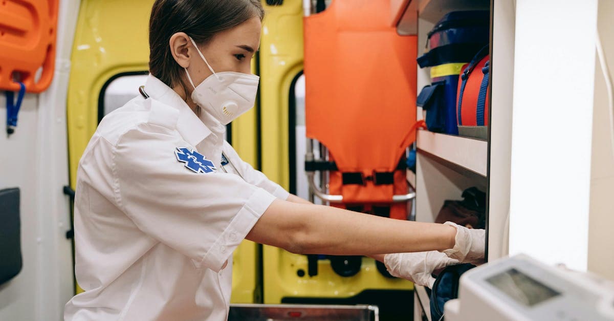 Female paramedic organising supplies in an ambulance, highlighting why GHIC cards don't cover US medical costs