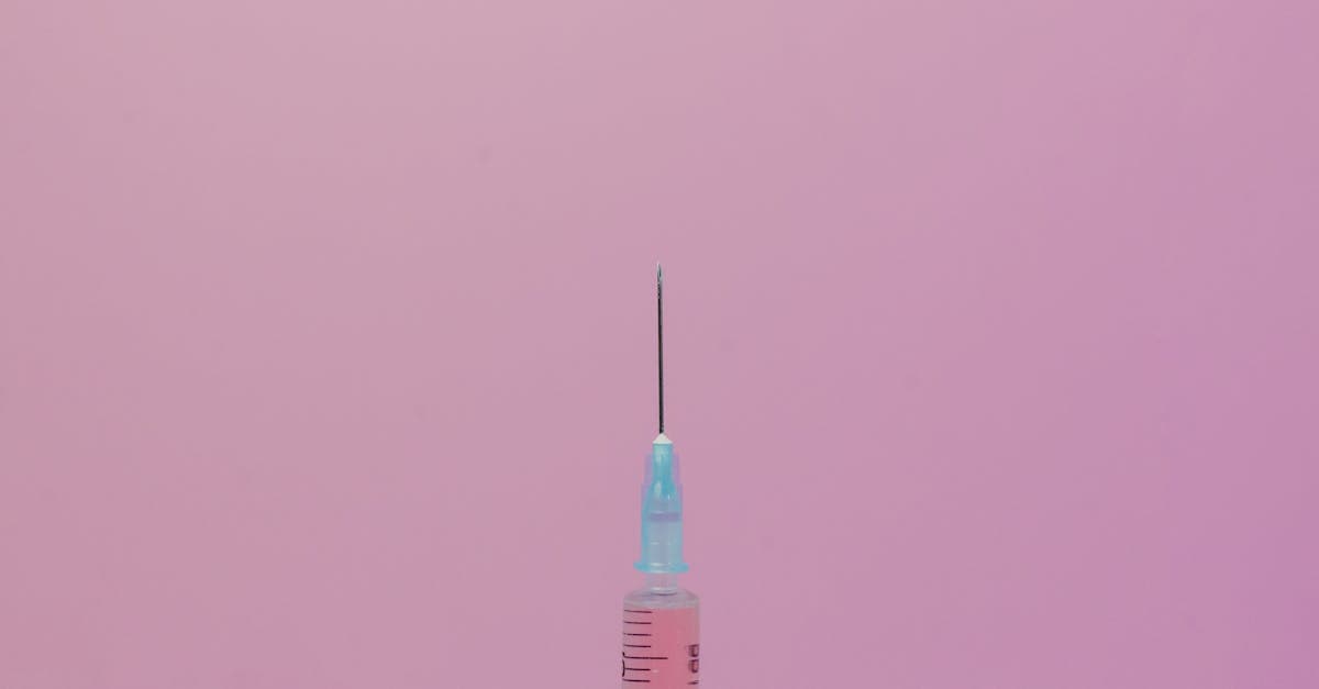 Close-up of a medical syringe needle highlighting the importance of travel vaccinations for safety abroad