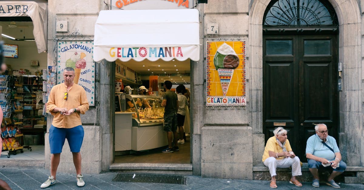 Colourful gelato display outside a bustling Roman gelateria, capturing the city's vibrant street food culture