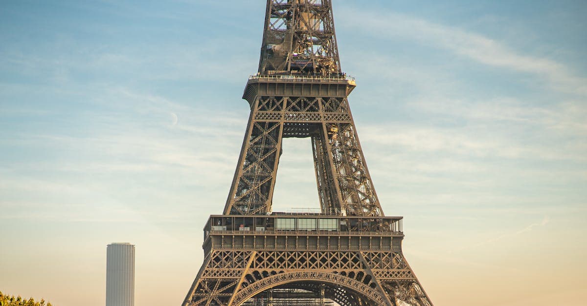 Eiffel Tower's intricate lattice structure against a clear Paris sky — know the best time to visit Paris in 2026