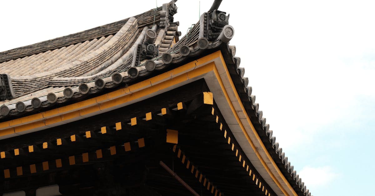 Intricate details of a traditional Kyoto temple roof, showcasing the best things to do in Japan
