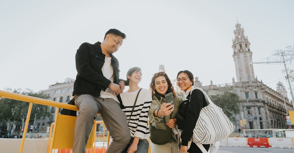 Friends taking selfie in Barcelona near historic buildings while selecting their eSIM Europe plan