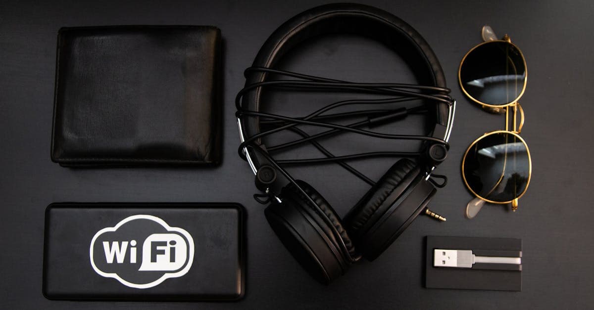 Portable wifi device displayed alongside travel essentials including headphones, wallet, and sunglasses