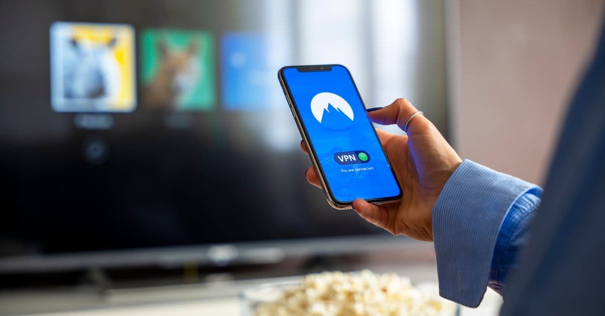 Smartphone displaying mobile virtual network operator plan options for affordable wireless service.