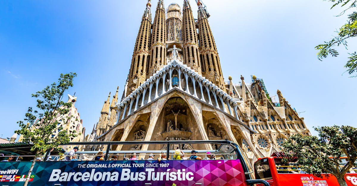 Tourists gathered outside the Sagrada Família basilica, a landmark visit on any barcelona holiday