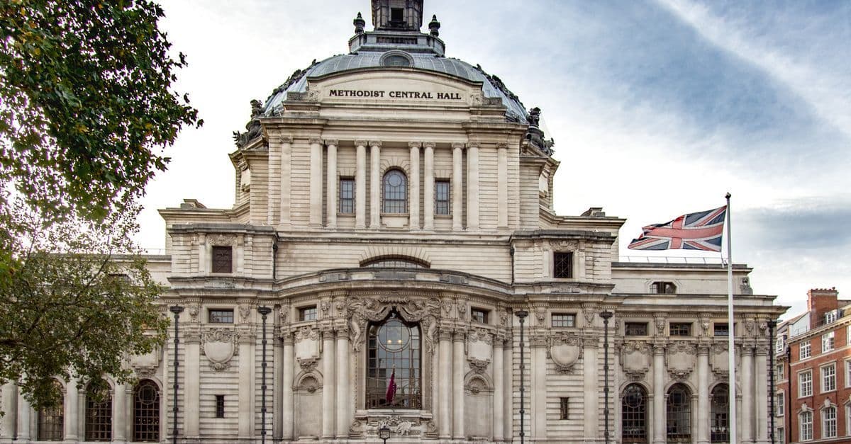 International Hall London entrance area near Methodist Central Hall with British flag visible against the sky.