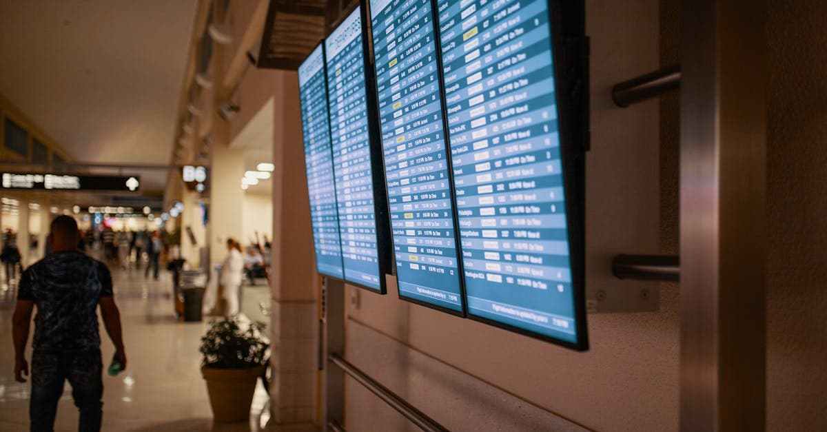 Airport terminal with digital flight information boards, key to booking cheap city breaks at the best price