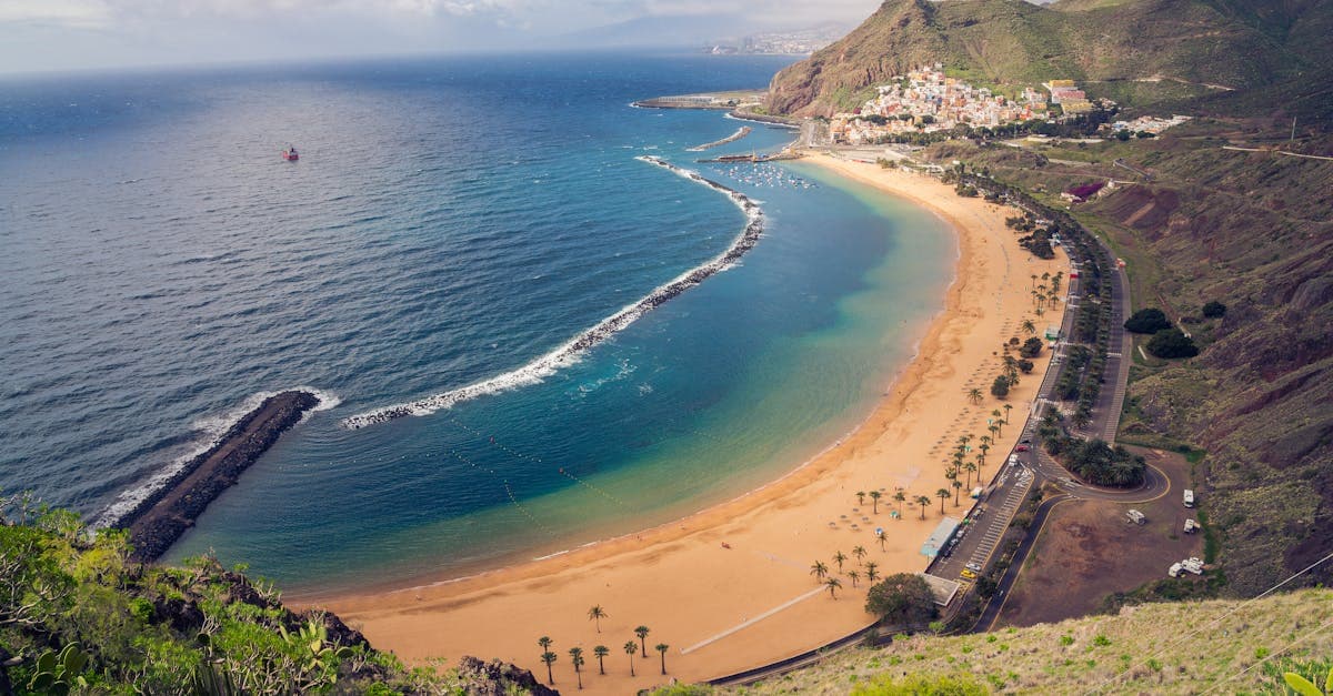 Golden sands and clear blue waters along Tenerife's coast during the best time to visit Tenerife for sunshine
