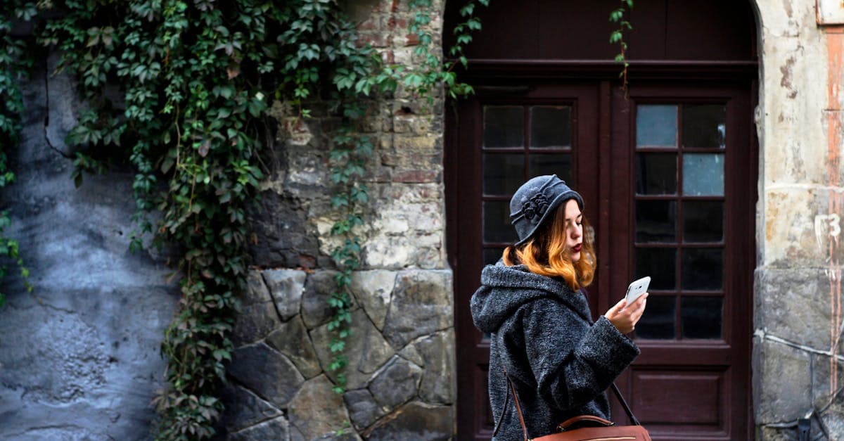 Traveler in L'viv, Ukraine comparing the best eSIM for Europe 2026 plans on her smartphone.