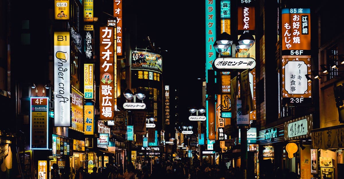 Shibuya crossing at night with neon signs, where esim japan keeps you connected to navigate the city.