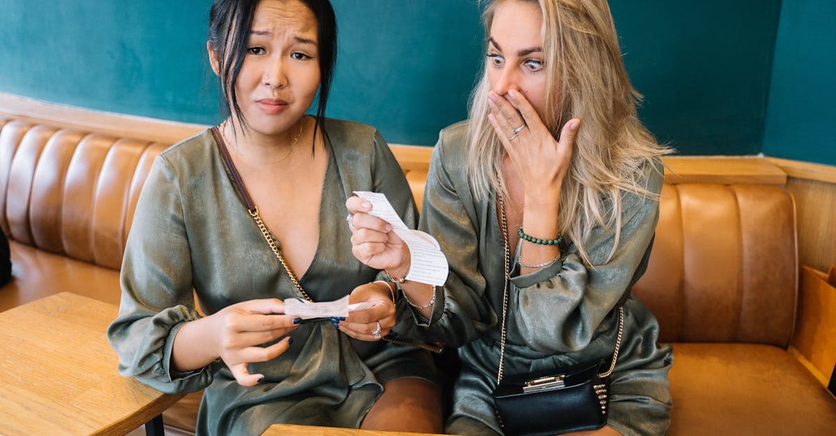 Two travellers reacting to a costly roaming bill, making the case for a travel eSIM in Europe