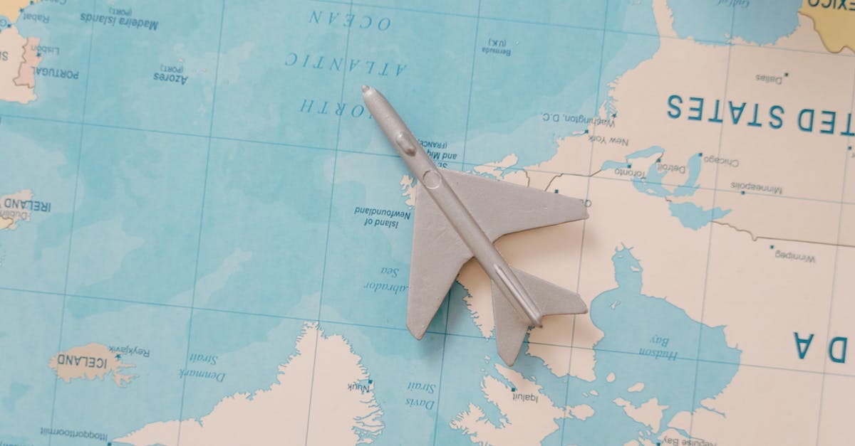 A toy airplane resting on a map, symbolizing travel and adventure planning.