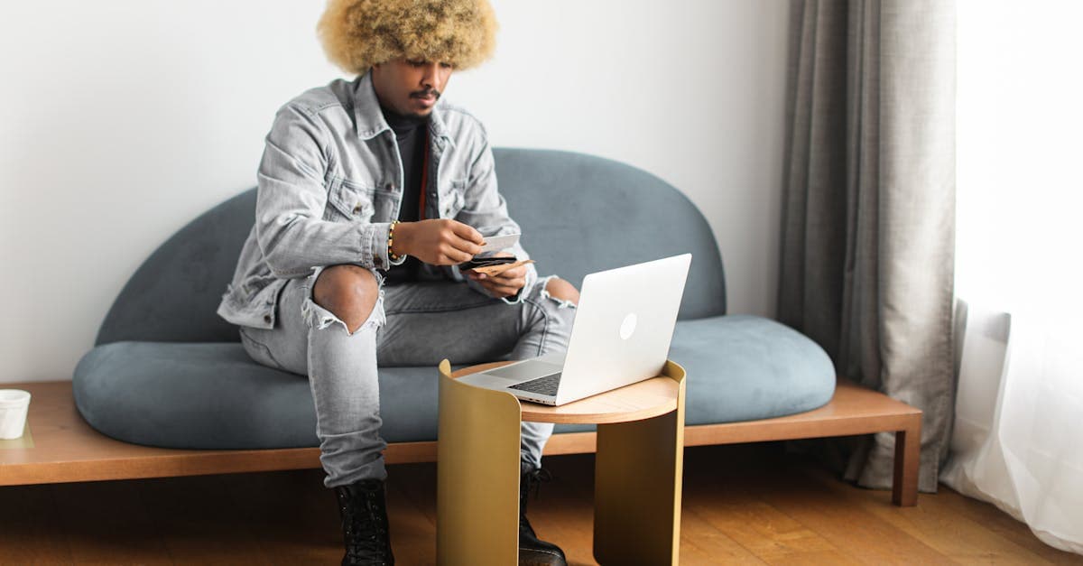 Traveller using smartphone and laptop to activate a travel eSIM for short-stay Singapore connectivity