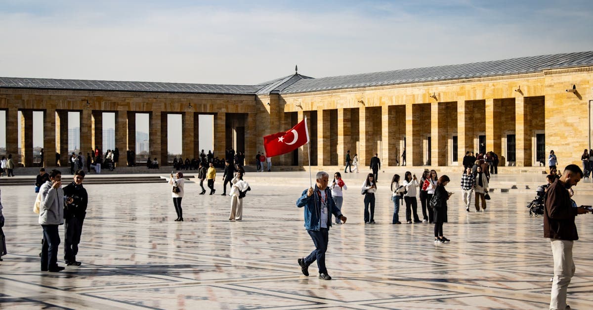 Anıtkabir courtyard filled with visitors on an autumn day, exploring Ankara as UK tourists with legal esim turkey access.