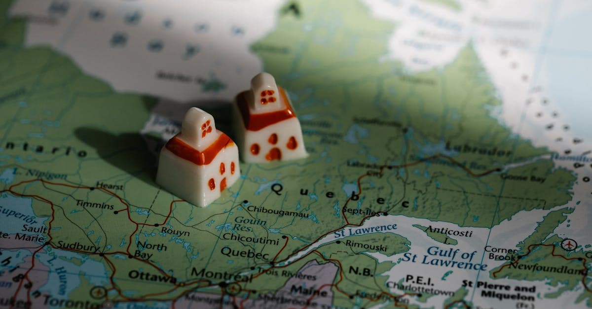 Miniature house figurines placed on a Canadian map, illustrating what makes a destination truly affordable