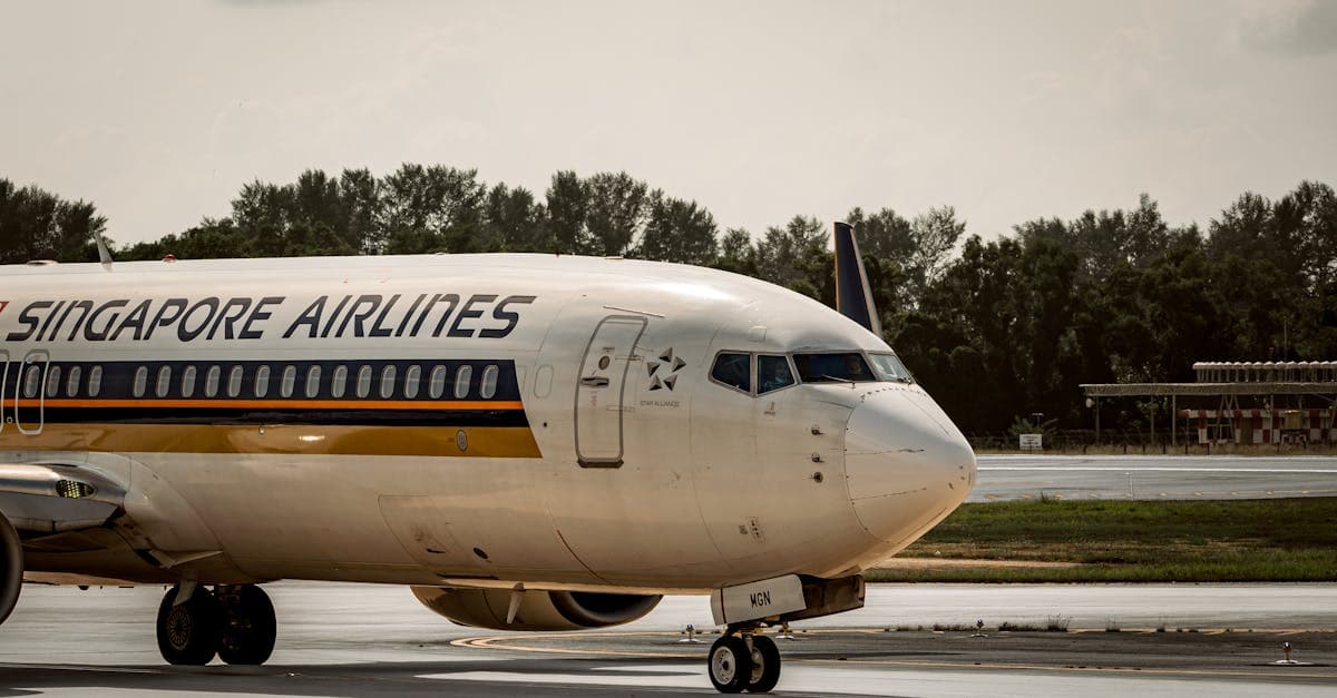 Budget airline plane taxiing on Singapore airport runway showcasing cheap flights from Singapore in 2026