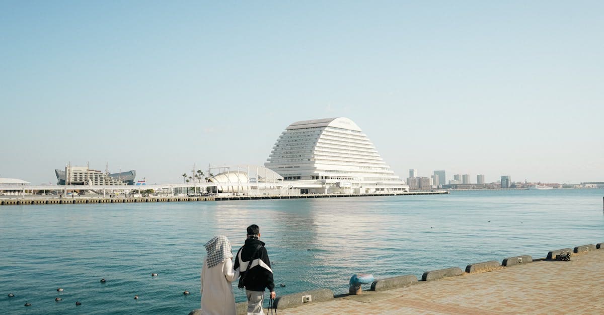 Travelers exploring Kobe's scenic waterfront using data-heavy navigation apps on their esim japan plan.