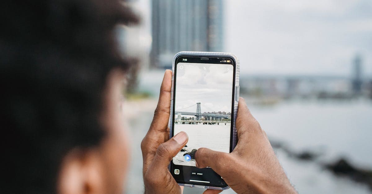 Traveler photographing a bridge while staying connected abroad with a travel eSIM in New Zealand.