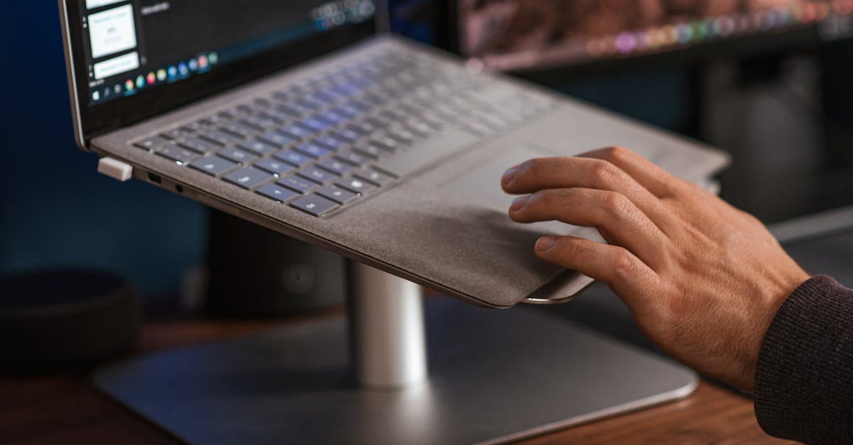 Remote worker using a MiFi hotspot to connect a laptop while working from a home desk