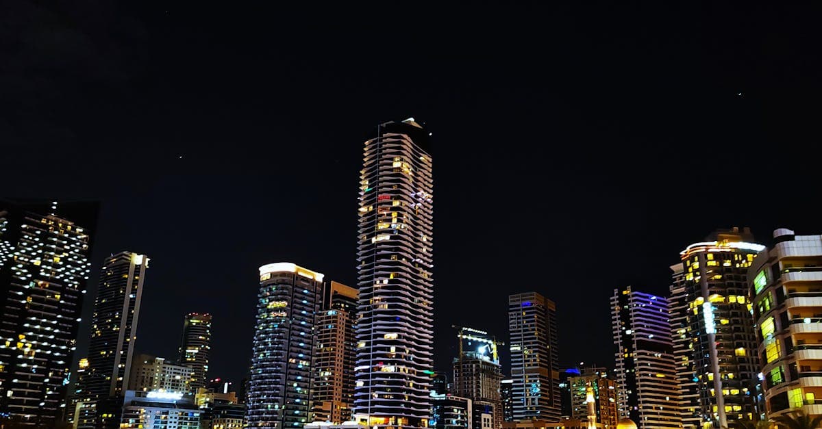 Dubai Marina's glittering skyline reflected in the water at night, one of the best free things to do in Dubai