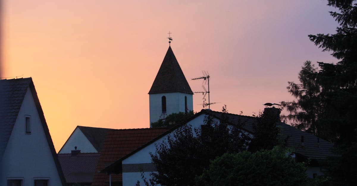 Silhouette of a church in Nürnberg at sunset highlighting urban architecture.