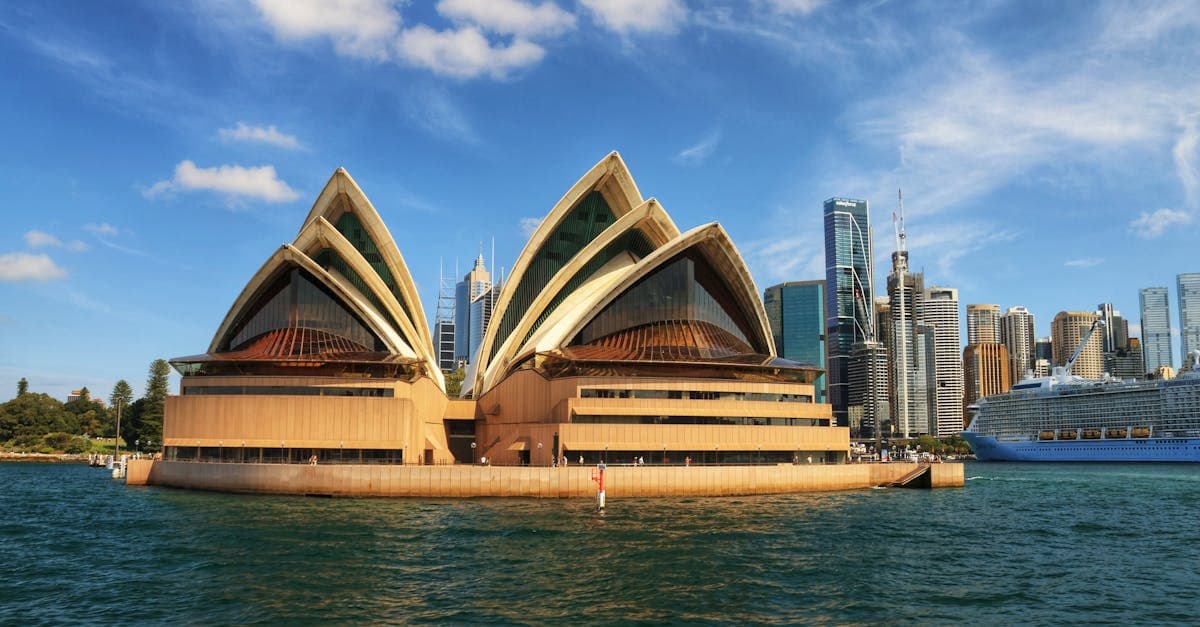 Sydney Opera House and harbour skyline, the iconic departure point for a cruise to New Zealand from Sydney.