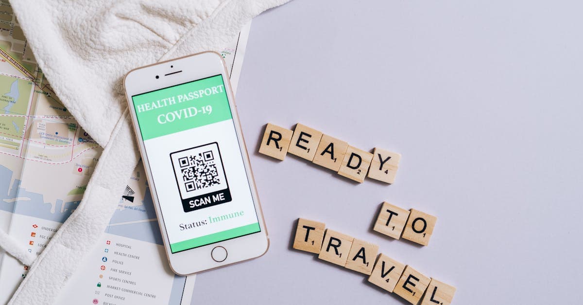 A smartphone showing a COVID-19 health passport next to Scrabble letters spelling 'Ready to Travel'.
