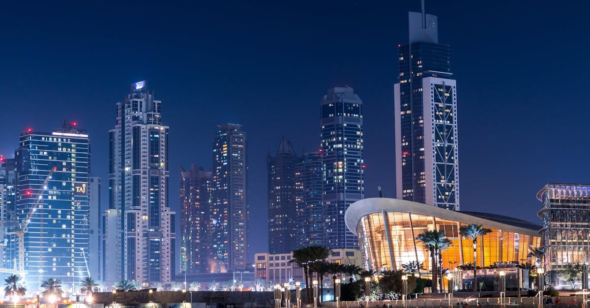Dubai's shimmering skyline reflected on water at night, showing why staying connected is key for South African travellers