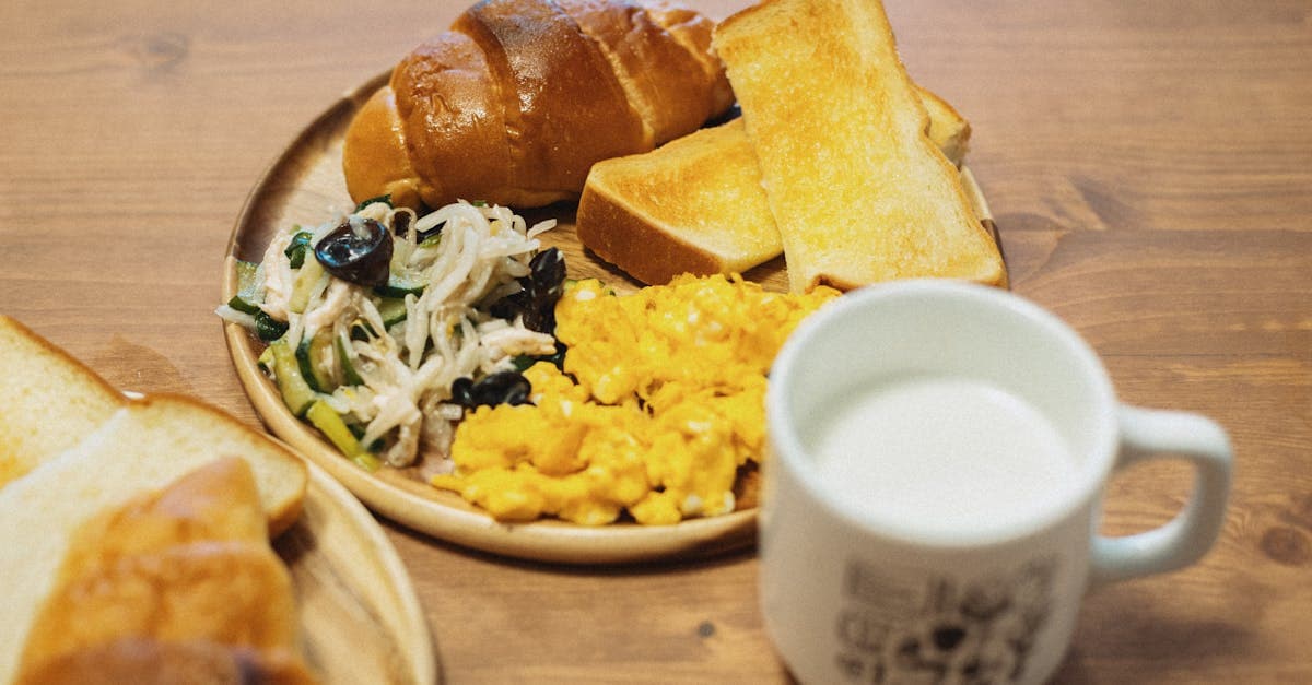 Tasty Japanese breakfast with scrambled eggs, bread, salad, and milk. Captured in Itabashi City, Tokyo.
