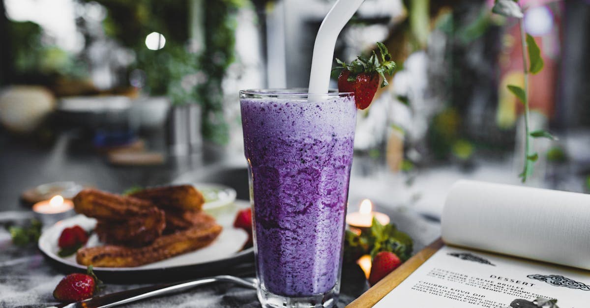 Fresh berry smoothie with fruit garnish, a refreshing Balinese dessert drink worth seeking out