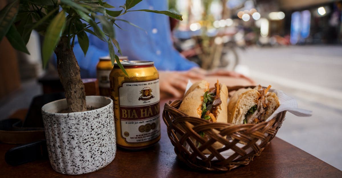 Vietnamese banh mi and egg coffee ca phe trung on a rustic street-side cafe table in Hanoi.