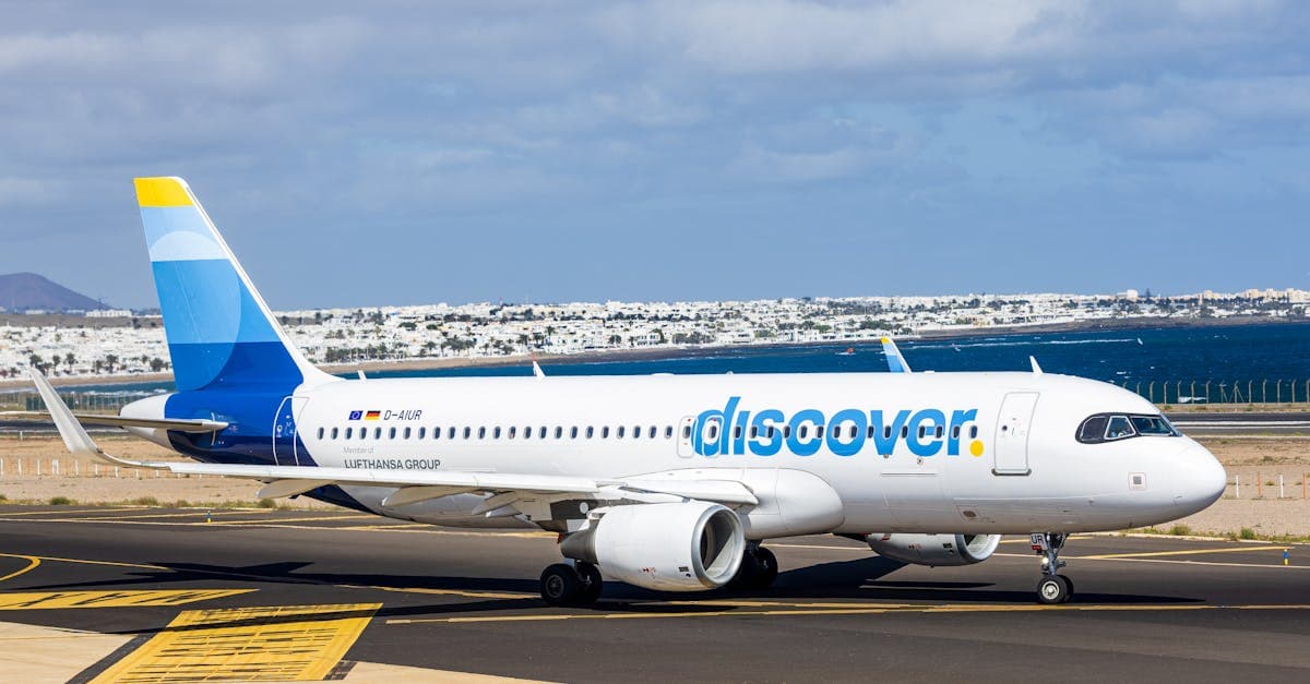 A scenic road winding through Lanzarote's volcanic landscape, showing how to get around the island