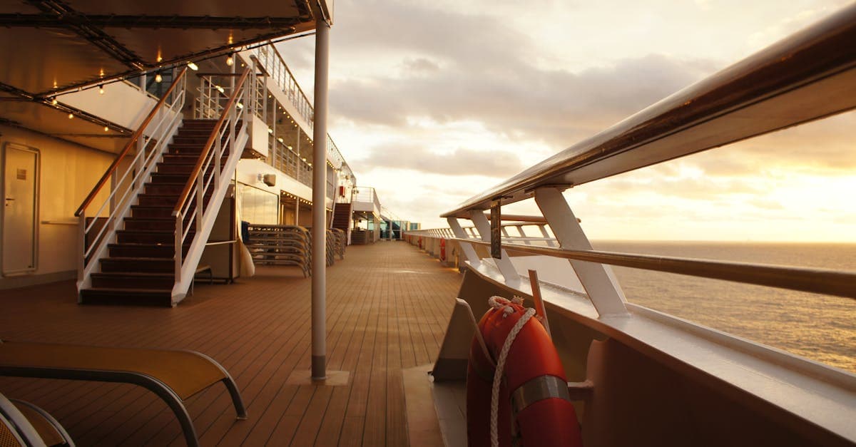 Serene cruise ship balcony deck glowing at sunset, showcasing the peaceful views gained from a free Carnival upgrade