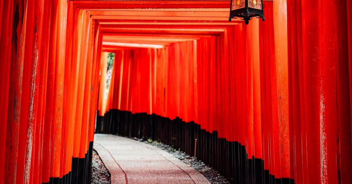 Iconic red torii gates at Fushimi Inari Shrine in Kyoto, a highlight of any Japan itinerary
